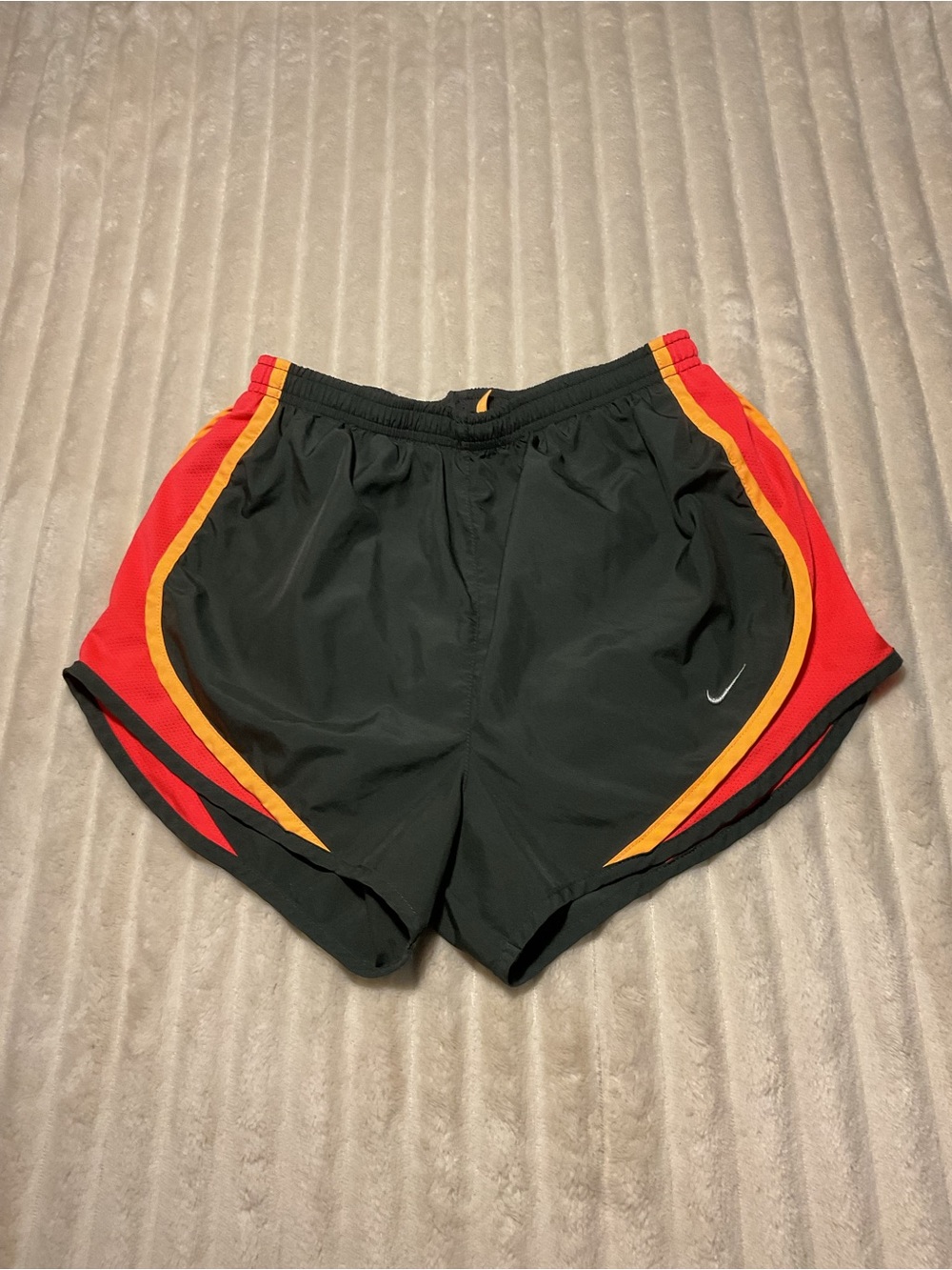 Nike Black Women’s Athletic Shorts with Red and Yellow Accent